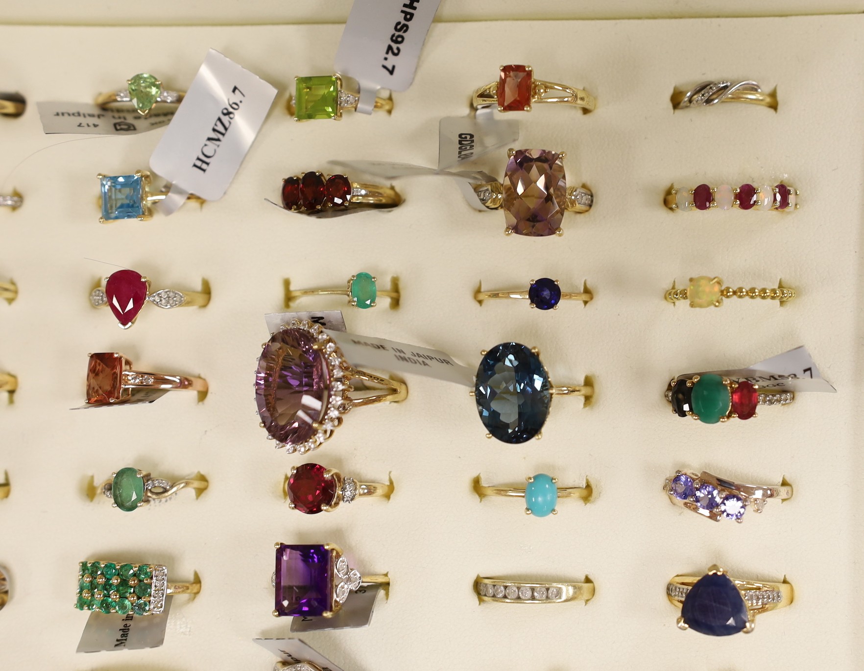 Forty three assorted modern 9ct gold and gen set dress rings including amethyst, emerald and garnet, one 18ct gold and gem set ring and six assorted 925 rings, in ring box.